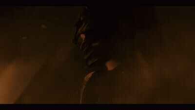 A Dragon With A Long Neck Is Surrounded By Flames And Smoke GIF