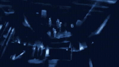 A Drawing Of A Group Of People In A Dark Room With A Cross In The Middle GIF