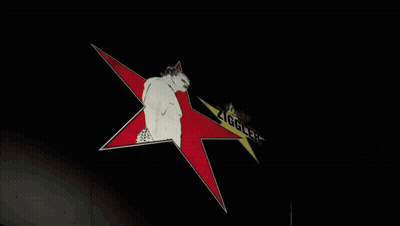 A Drawing Of A Man Standing In Front Of A Star That Says " Ziggler " GIF