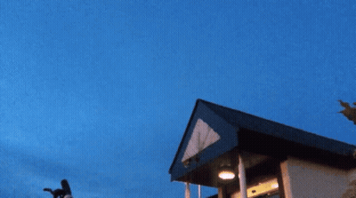 A Drawing Of A Swirling Object With A Blue Sky In The Background GIF