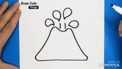 A Drawing Of A Volcano Is Being Drawn On A Piece Of Paper GIF