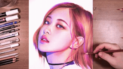 A Drawing Of A Woman 'S Face Is Being Drawn By A Person With A Pencil GIF