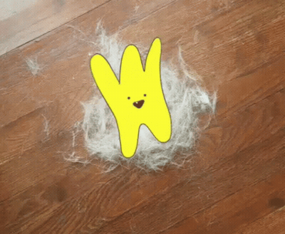 A Drawing Of A Yellow Bunny With A Face Is On The Floor GIF