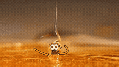 A Drop Of Liquid Is Being Poured Into A Container GIF