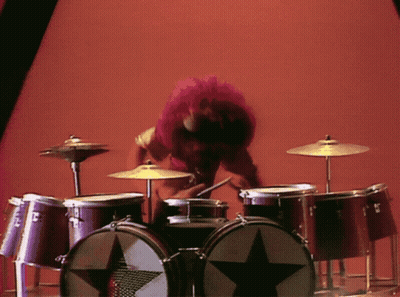 A Drum Set With A Black Star On The Drum GIF