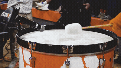 A Drum With A Microphone Attached To It That Says Clens GIF