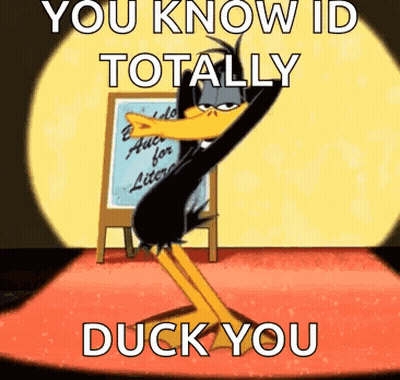 A Duck From Looney Tunes Is Dancing On A Stage In Front Of A White Board . GIF