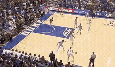 A Duke Basketball Game Is Being Played In Front Of A Huge Crowd GIF