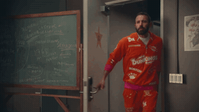 A Dunkin ' Barrel With A Person Covered In Chocolate GIF