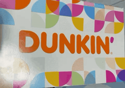 A Dunkin ' Donut Box With A Colorful Pattern GIF