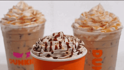 A Dunkin Donuts Cup With Whipped Cream On Top GIF