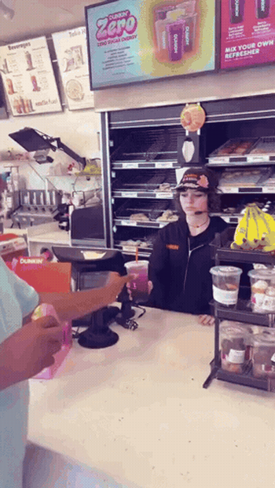 A Dunkin ' Donuts Worker Serves A Customer GIF