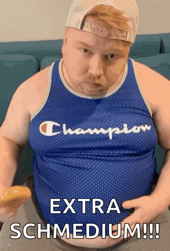 A Fat Man In A Champion Tank Top Is Eating A Donut GIF
