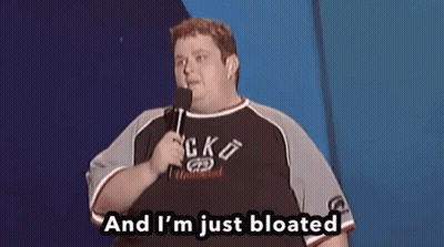 A Fat Man Is Holding A Microphone And Saying And I 'M Just Bloated GIF