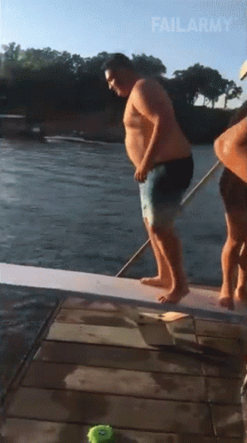 A Fat Man Is Jumping Into A Body Of Water With Failarmy Written On The Bottom GIF