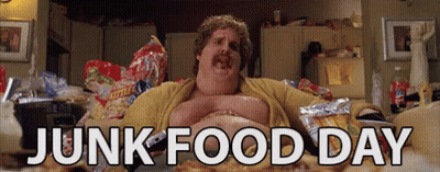 A Fat Man Is Laying On A Couch With Junk Food Day Written In White Letters GIF
