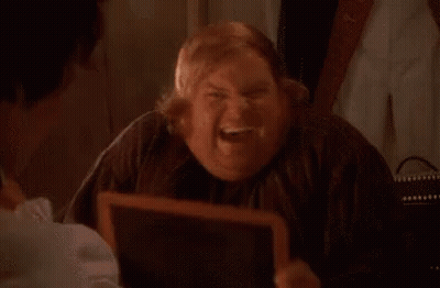A Fat Man Is Looking At Himself In A Mirror And Smiling . GIF