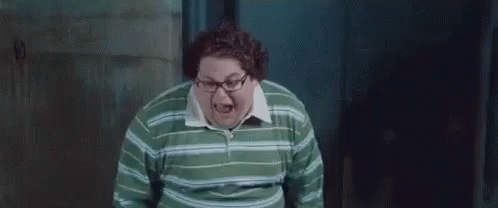 A Fat Man Wearing Glasses And A Green Striped Shirt Is Screaming . GIF