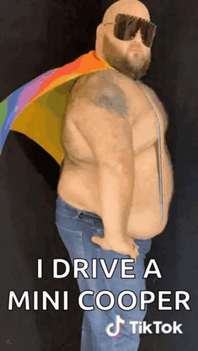 A Fat Man Wearing Sunglasses And A Rainbow Cape Says I Drive A Mini Cooper Tiktok GIF