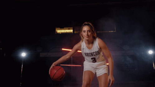A Female Basketball Player For The Broncos Is Dribbling A Basketball GIF