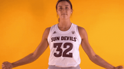 A Female Basketball Player For The Sun Devils Is Flexing Her Muscles GIF