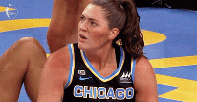 A Female Basketball Player From Chicago Is Sitting On The Floor GIF