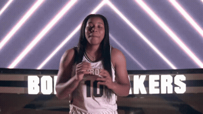 A Female Basketball Player In Front Of A Sign That Says Kers GIF