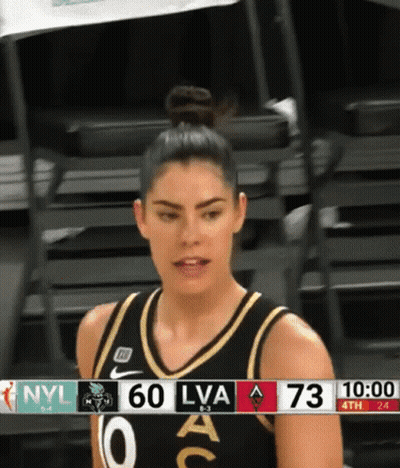 A Female Basketball Player Stands In Front Of A Scoreboard With Nyl 60 Lva 73 GIF