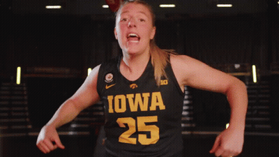 A Female Basketball Player Wearing A Black Jersey With Iowa 25 On It GIF