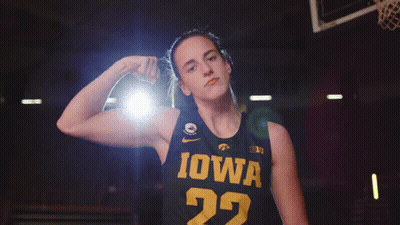 A Female Basketball Player Wearing A Black Jersey With Iowa On It GIF