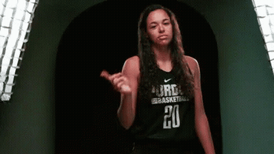 A Female Basketball Player Wearing A Black Jersey With The Number 20 On It GIF