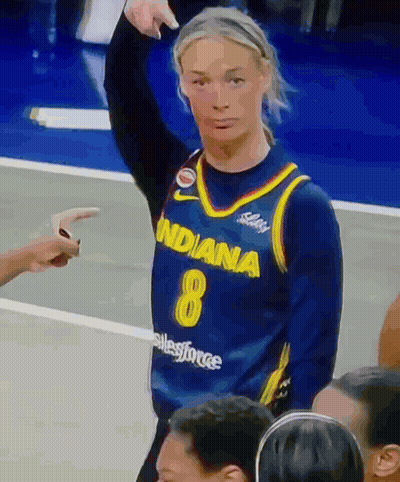 A Female Basketball Player Wearing A Blue Indiana 8 Jersey GIF