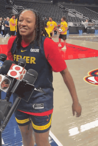A Female Basketball Player Wearing A Fever Jersey GIF