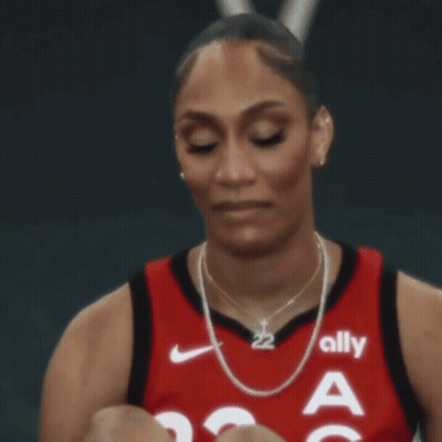 a female basketball player wearing a jersey that says ally on it
