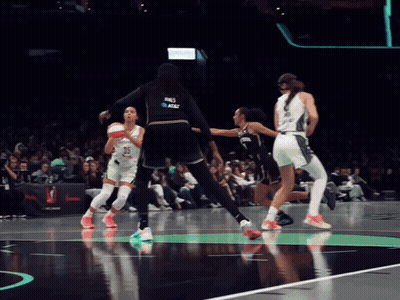 A Female Basketball Player Wearing A Jersey That Says At & T On It GIF