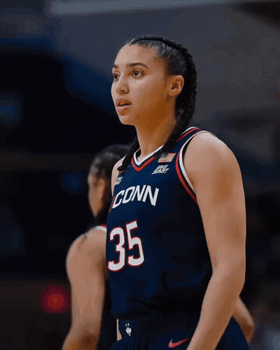 A Female Basketball Player Wearing A Jersey That Says Conn 35 GIF