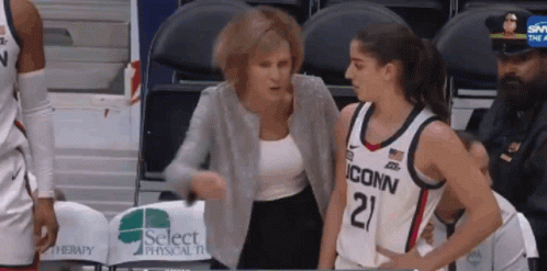 A Female Basketball Player Wearing A Jersey That Says Iconn GIF