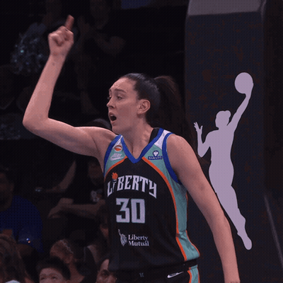 A Female Basketball Player Wearing A Jersey That Says Liberty 30 GIF