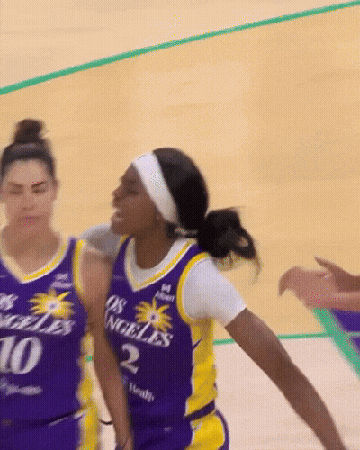 A Female Basketball Player Wearing A Jersey That Says Los Angeles On It GIF