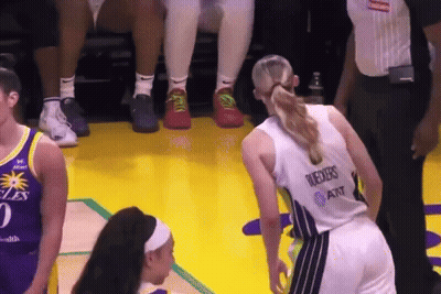 A Female Basketball Player Wearing A Jersey That Says ' Reeves At & T ' On The Back GIF