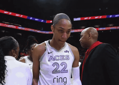 A Female Basketball Player Wearing A Jersey With The Number 22 On It GIF