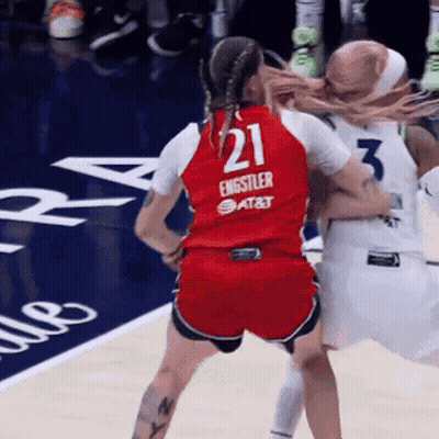 A Female Basketball Player Wearing A Red Jersey With The Number 21 On It GIF