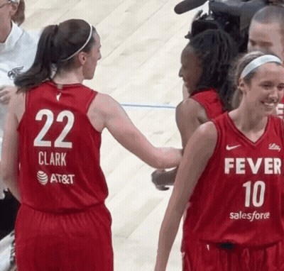 A Female Basketball Player Wearing A Red Jersey With The Number 22 On The Back GIF