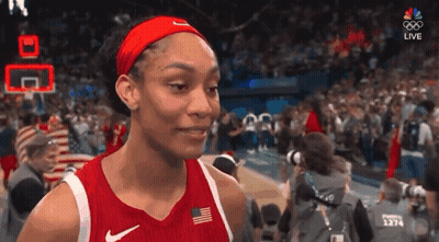 A Female Basketball Player Wearing A Red Nike Jersey And Headband GIF