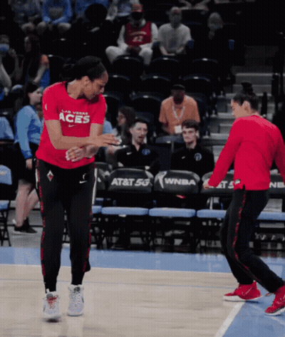 A Female Basketball Player Wearing A Red Shirt That Says Las Vegas Aces GIF