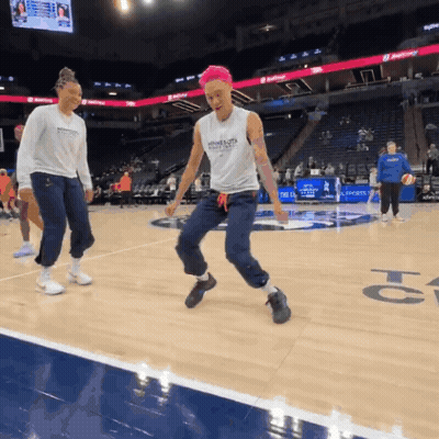 A Female Basketball Player Wearing A Tank Top With The Word Warriors On The Front GIF