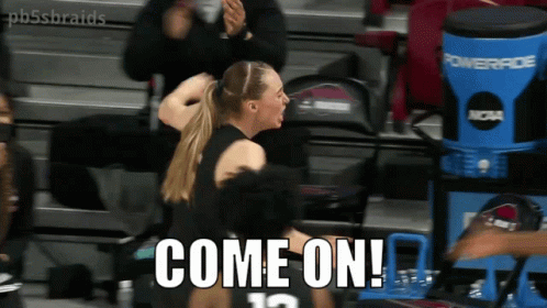 A Female Basketball Player With The Number 12 On Her Jersey GIF