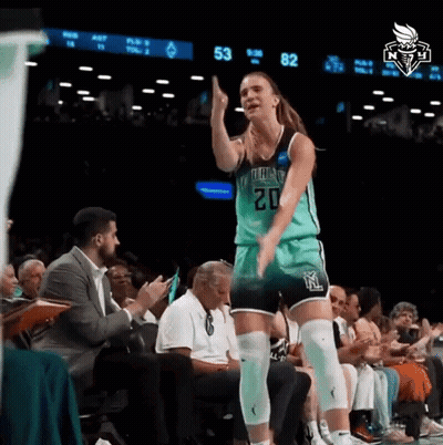 A Female Basketball Player With The Number 20 On Her Jersey Stands On The Court GIF