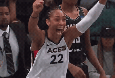 A Female Basketball Player With The Number 22 On Her Jersey Is Celebrating GIF