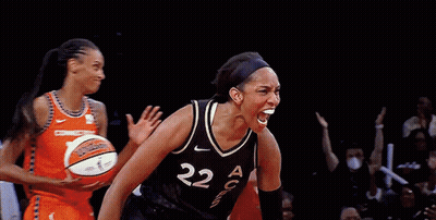A Female Basketball Player With The Number 22 On Her Jersey Is Celebrating GIF